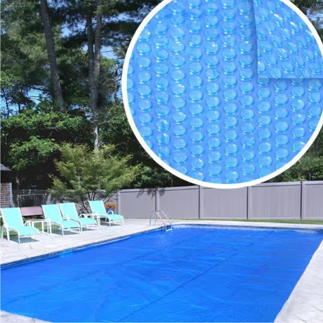 Blue pool cover with bubble texture on a poolside background